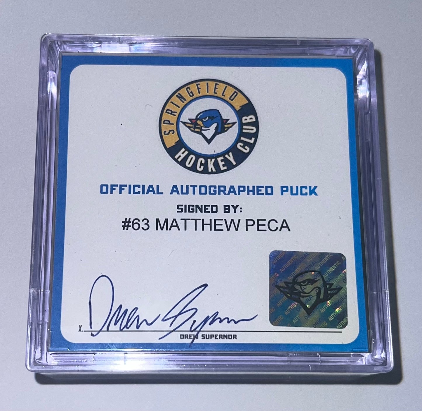 Signed Puck in Cube - #63 Matthew Peca